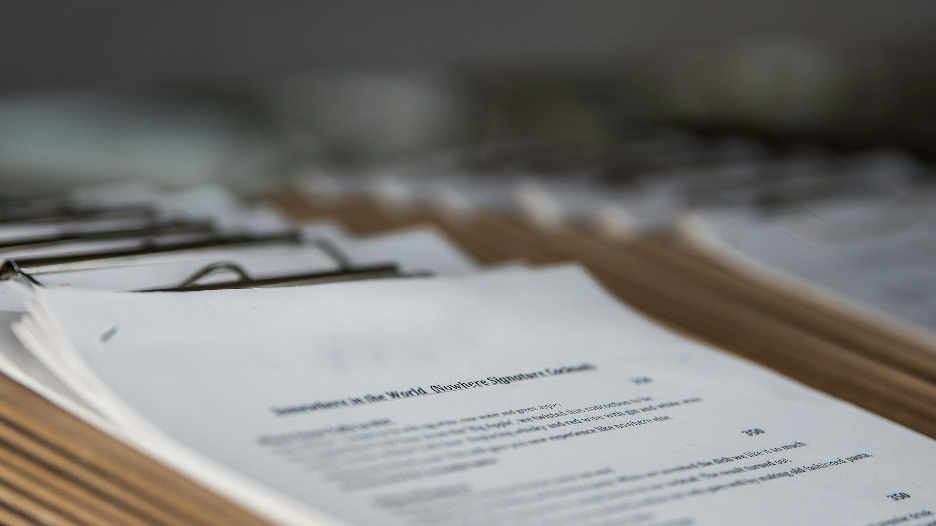 restaurant menus on clipboards close up